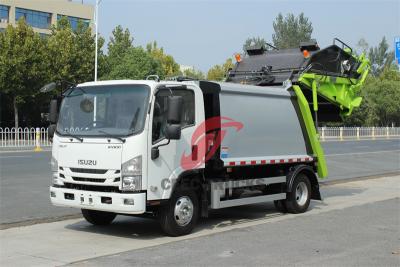 Trash compactor made by Isuzu trucks